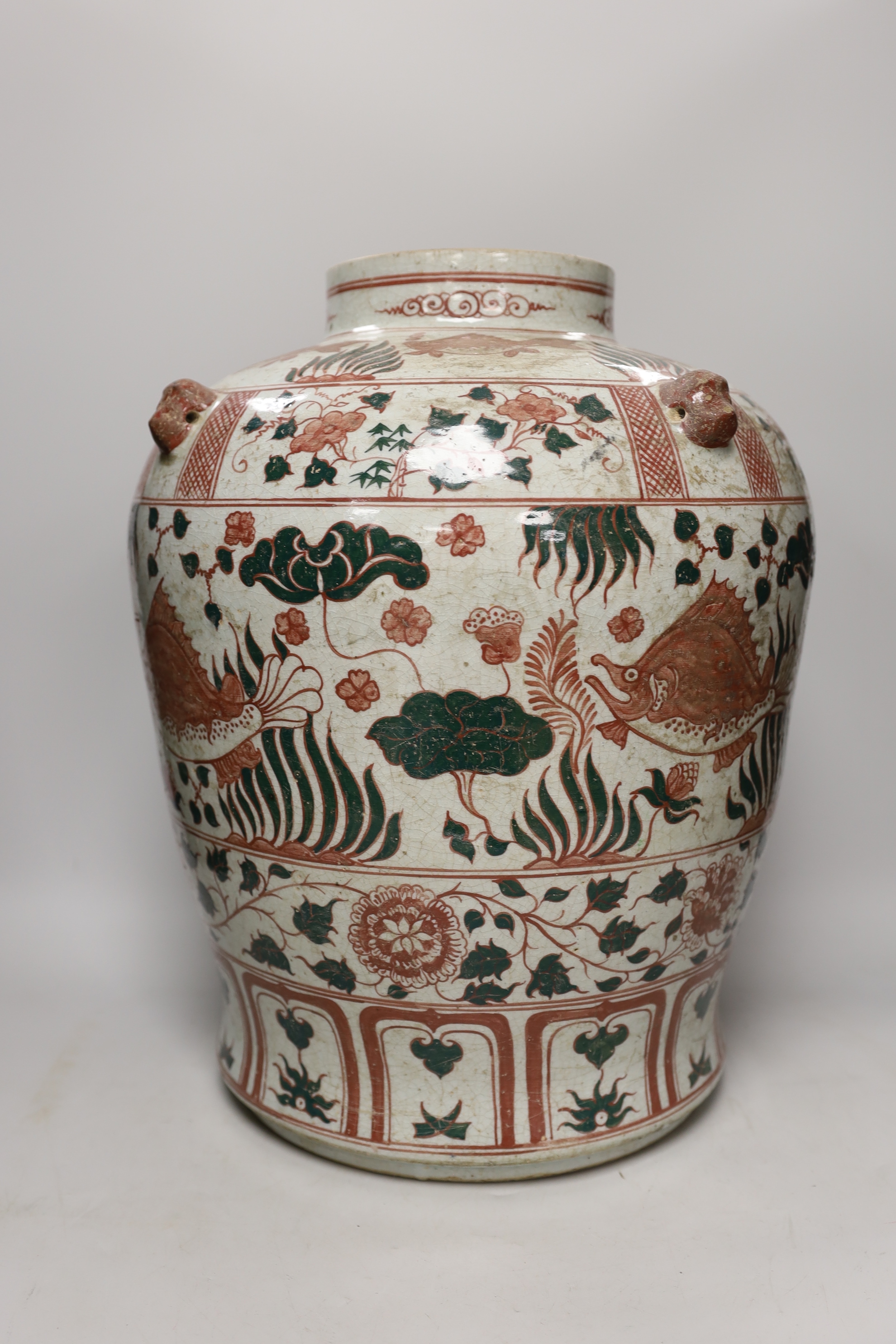 An Annamese enamelled porcelain ‘fish’ jar, 43cm high